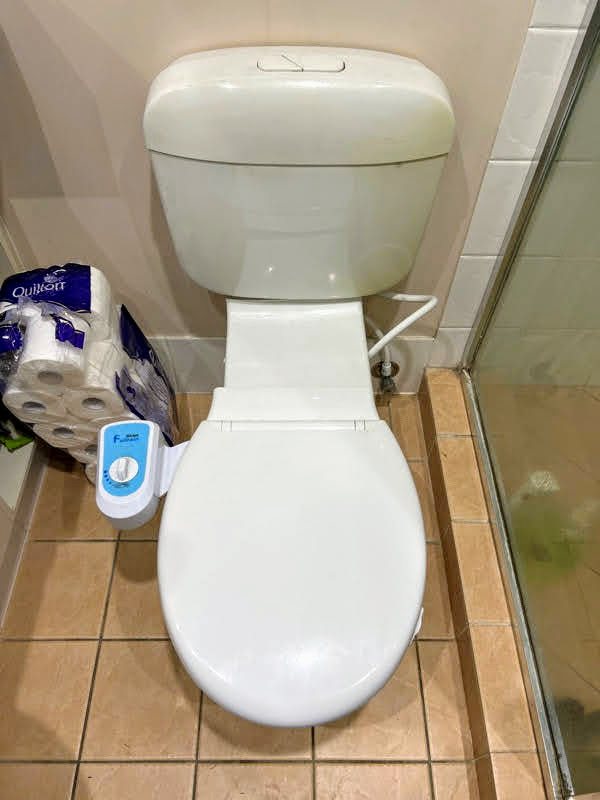 I install a bidet seat or douche hand spray to my toilet?
