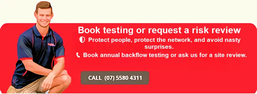 Plumber testing RPZ valve — backflow risk management programme Gold Coast